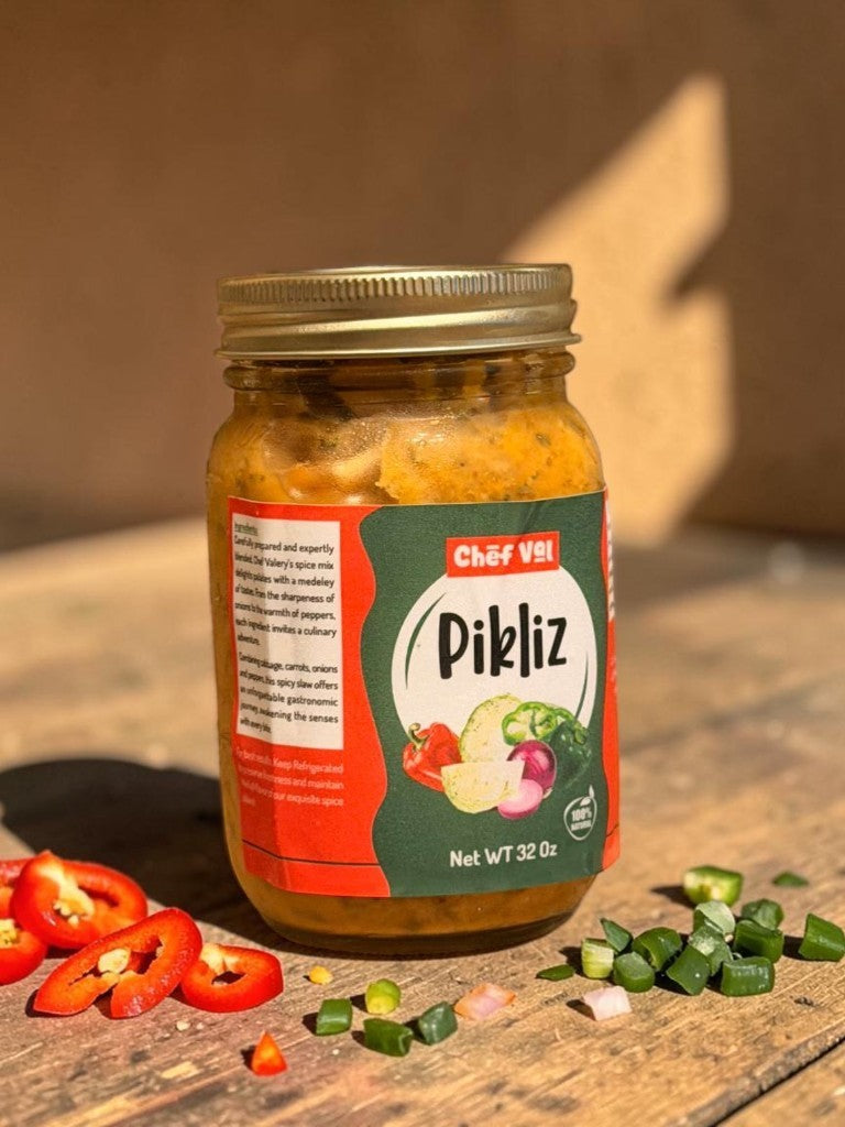 Chef Vél Pikliz Spicy Condiment Jar 32 Oz, a vibrant Haitian relish with cabbage, carrots, onions, and scotch bonnet peppers.
